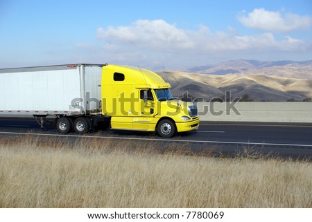 Semi-trailer rig heads west into the Sierra Nevada Mountains, California