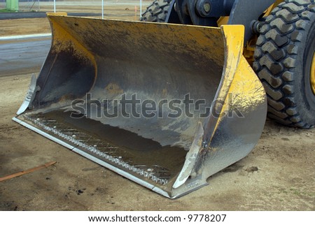 Bucket on bulldozer for utility work on construction job site