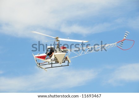 Helicopter used for aerial applications (crop dusting) in flight