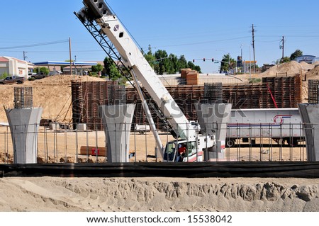 Men, material and machines construct a major freeway interchange, California