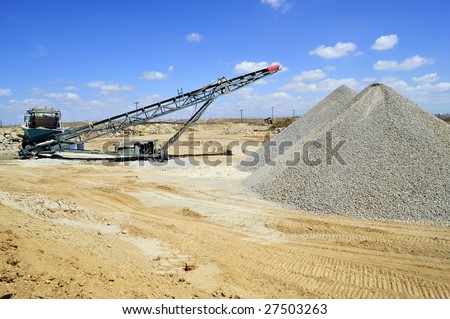 Conveyor belt and portable materials handling equipment used for aggregate (gravel) in a batch plant