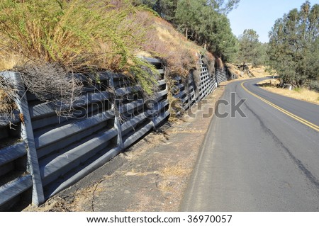 Bin-type retaining wall protects mountain road from landslides