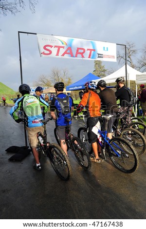 BAKERSFIELD, CA -FEB 21:Rain and cold at the start of the Foothill Classic Mountain Bike Race  do not deter contestants from racing February 21, 2010 in Bakersfield, CA
