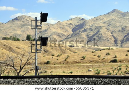 A railroad signal in California\'s golden foothills of the Sierra Nevada Range