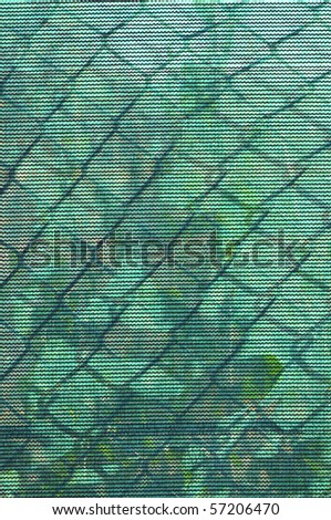 Background, texture or abstract: Shadow of weeds on chain link fence make interesting patterns
