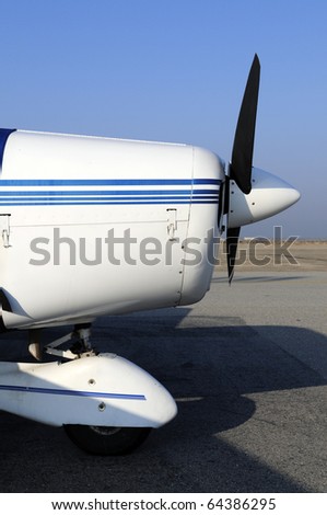 Nose section of a four place low wing fixed gear general aviation aircraft