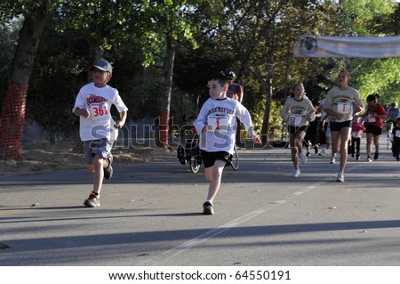 BAKERSFIELD, CA - NOV 6: Unidentified young runners start the fun run at the 28th Annual Police memorial Run on November 6, 2010, at Bakersfield, California.