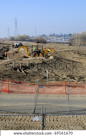 BAKERSFIELD, CA - JAN 22: Construction crew is installing underground utilities for the Kern River Upland and River Edge Restoration Project on January 22, 2011, at Bakersfield, California.