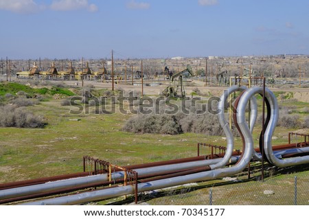 Kern County, California, oil fields showing heaters and steam pipes used to heat crude in the ground