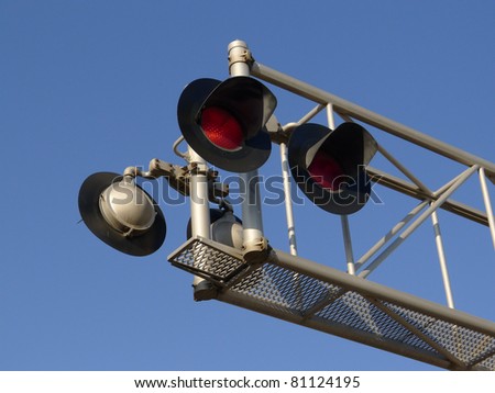 Flashing red signal lights at railroad grade crossing