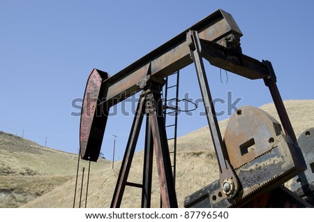 Oil is pumped on California lease using walking beam pumpjack