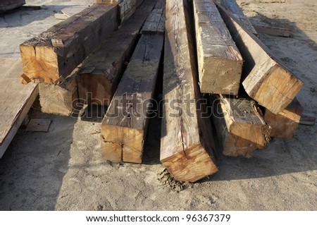 Contractor\'s lay down area for storage of wooden timbers used as temporary shoring on a bridge construction project