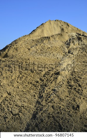 Background or Texture: A large dirt mound on a construction job site