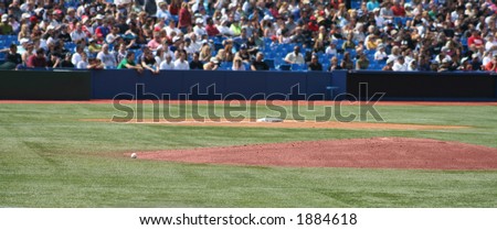 Baseball and the mound at a baseball game