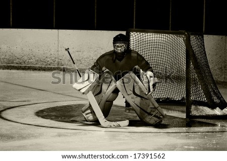 Grunge edit of a hockey goaltender during an ice hockey game.