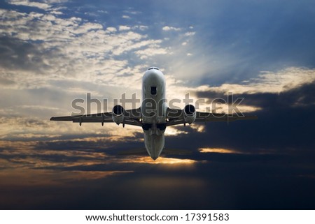 Commercial airliner taking off with sky background