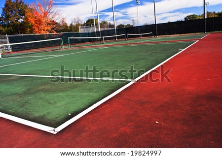 Tennis playing surface known as hard court.  Similar to the surface used in the Australian Open and U.S. Open grand slam tournaments.