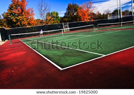 Tennis playing surface known as hard court.  Similar to the surface used in the Australian Open and U.S. Open grand slam tournaments.