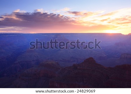 Wide-angle view of the Grand Canyon just before the sun rises.