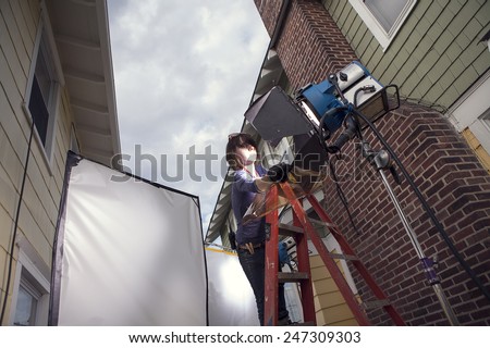 Film crew preparing set for film shoot