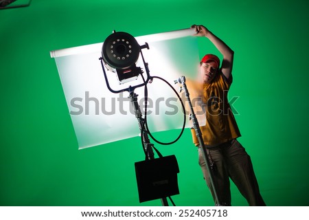 film crew working in green screen studio