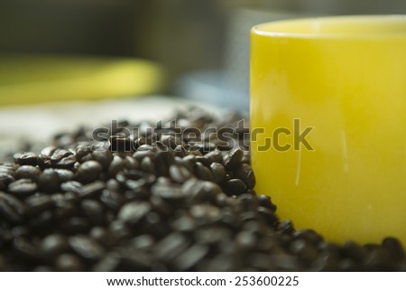 coffee beans and yellow mug