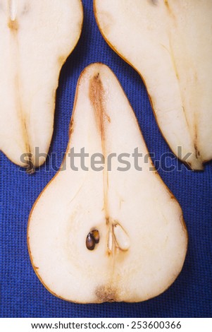 slices of pear on blue background