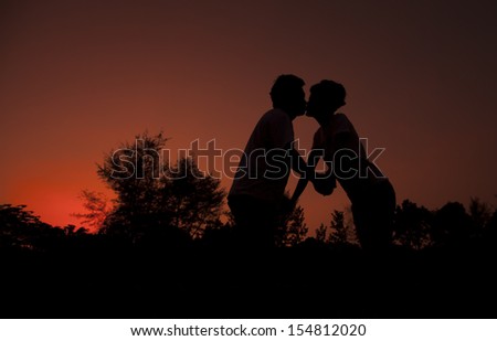 Kissing couple over evening