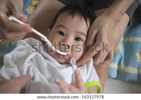 Asians eat babies mouth mess forced to eat.