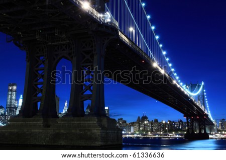 new york city at night skyline. stock photo : New York City Skyline and Manhattan Bridge At Night