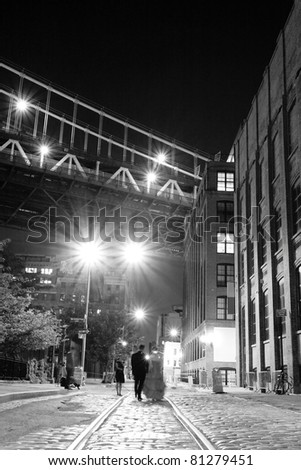 Photo session on a street under the  Manhattan Bridge in Brooklyn NYC at night