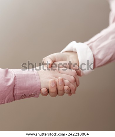 Close-up image of business people shaking their hands