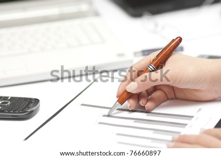 Business concept - office worker analyzing chart data