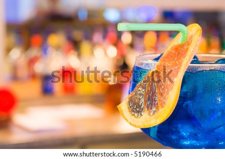 Cocktail with ice shards in a wet glass