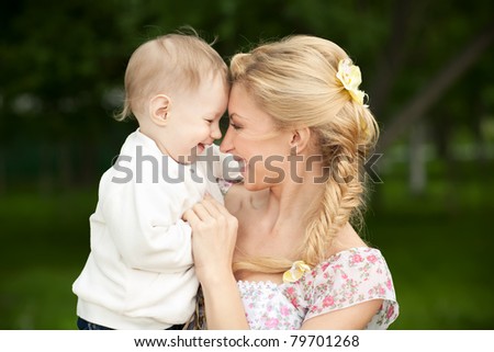 stock photo Happy blonde mom and son outdoors