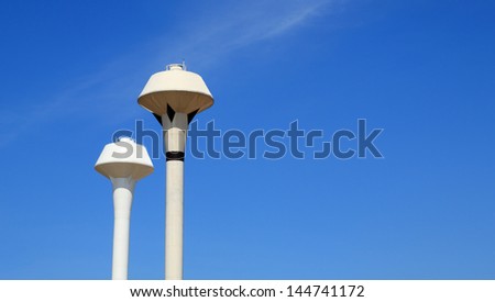 High storage tank for supply water, clear blue sky background