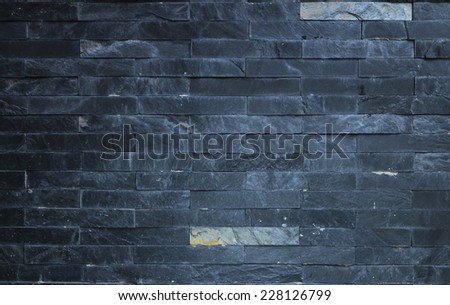 Black brick stone background.