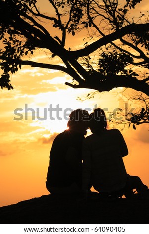 man and woman in sunset