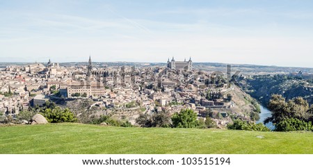 Distant view of the the Spanish city of Toledo, in one side the river tagus, in the other side the medieval city of Toledo environment  You can see the village surrounded by the Tagus river