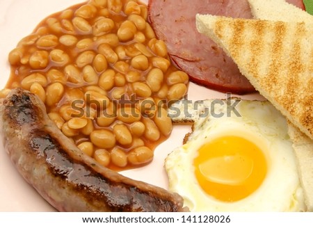 English breakfast with beans, eggs, sausage and toast