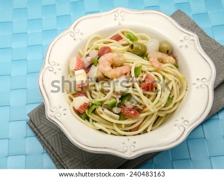 Spaghetti with seafood salad served on a plate