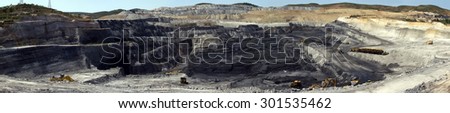 Panoramic photo of a coal quarry, where the extent of mining and com is has transformed the landscape.