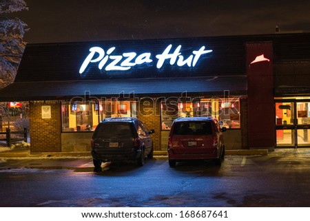 TORONTO,CANADA - DECEMBER 23: Pizza Hut Restaurant. The brand has taken root in Canadian culture.After an ice storm they remain among the few offering delivery. Seen in Toronto, Canada on Dec 23, 2013