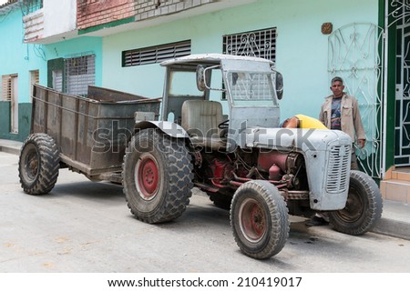 SANTA CLARA, CUBA-JUNE 28, 2014: Old tractor used for construction work. After the government economic reforms, citizens are improving their housing conditions with more ease and legal peace of mind.