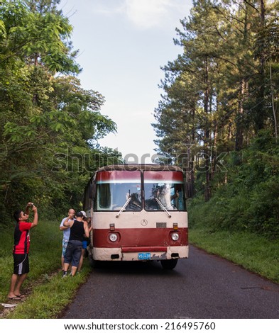 EL NICHO,CUBA-JULY 20,2014: Break in the road to El Nicho. This is a privately organized excursion using a government bus. After the economic reforms many different economic activities proliferate.