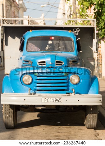 HAVANA,CUBA-JULY 17,2014: Old American Cars in Cuba. Scarcity in cars supply has made Cubans keep 1950\'s cars and older running through invention and innovation. Nowadays, they make income with them.