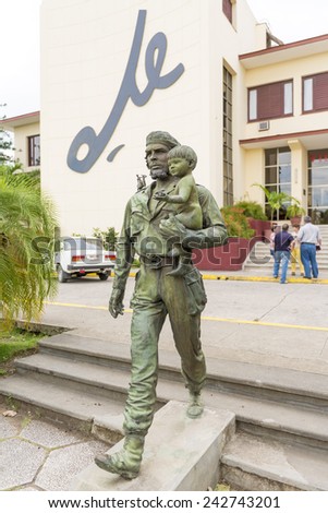 SANTA CLARA,CUBA-JULY 19,2014: Che Guevara statue or monument outside the Communist Party Headquarters in the city. The monument was designed by Jose Delarra, nowadays is a tourist landmark.