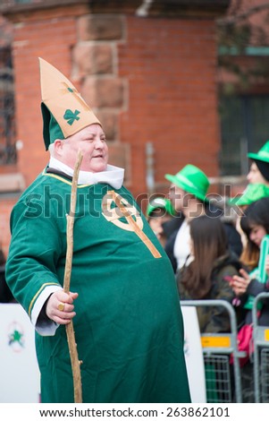 TORONTO,CANADA-MARCH 15,2015:Big man dressed up in complete green during the St. Patrick\'s Day Parade 28th edition which is the fourth largest celebration of its kind in the world.
