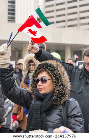TORONTO,CANADA-JANUARY 11,2015: Toronto people meets in the Je Suis Charlie vigil at Nathan Phillips Square to honor the victims of the Charlie Hebdo magazine and protest against terrorism.