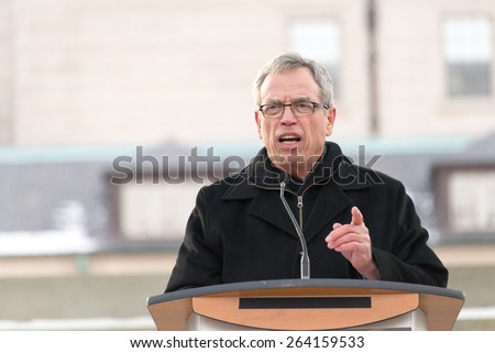 TORONTO,CANADA-JANUARY 11,2015: Joe Oliver, Minister of Finance in Canada addresses the people in a vigil at Nathan Phillips Square to honor the victims of the Charlie Hebdo magazine shootings